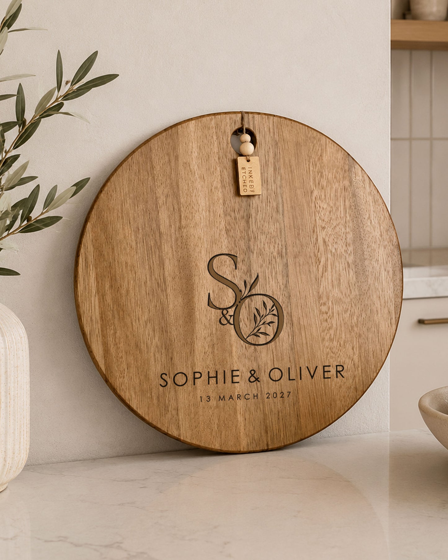 Personalised couple cheeseboard engraved with names and date, ideal wedding or anniversary keepsake.