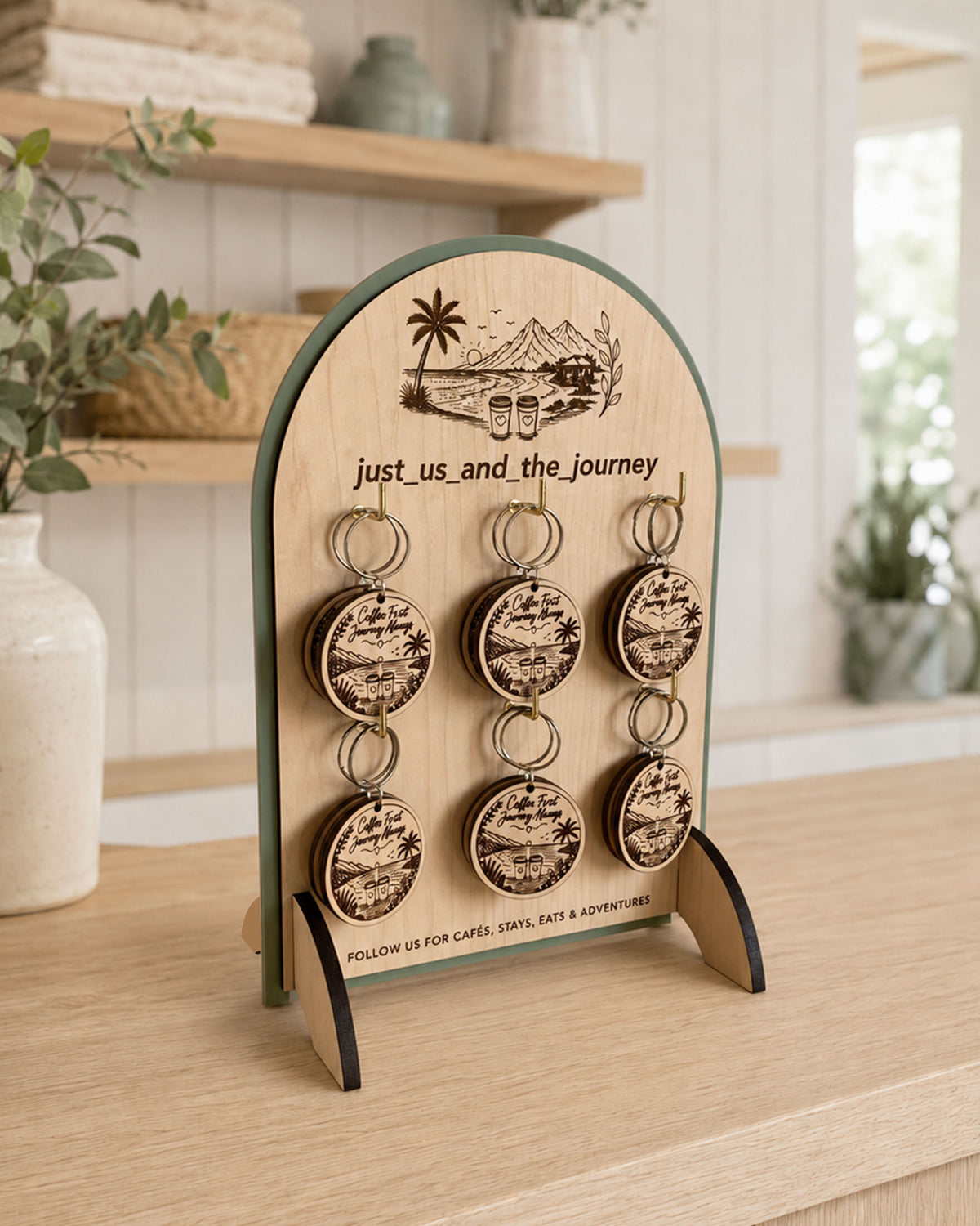 Close-up of a custom branded keyring display stand and engraved wooden keyring set.