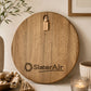 Custom engraved round serving board with the SlaterAir logo styled on a modern kitchen bench.