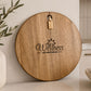 Premium round serving board personalised with the Wellness on Driftwood logo for corporate branding.
