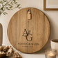 Custom engraved wedding charcuterie board with initials, names and wedding date on natural acacia timber.