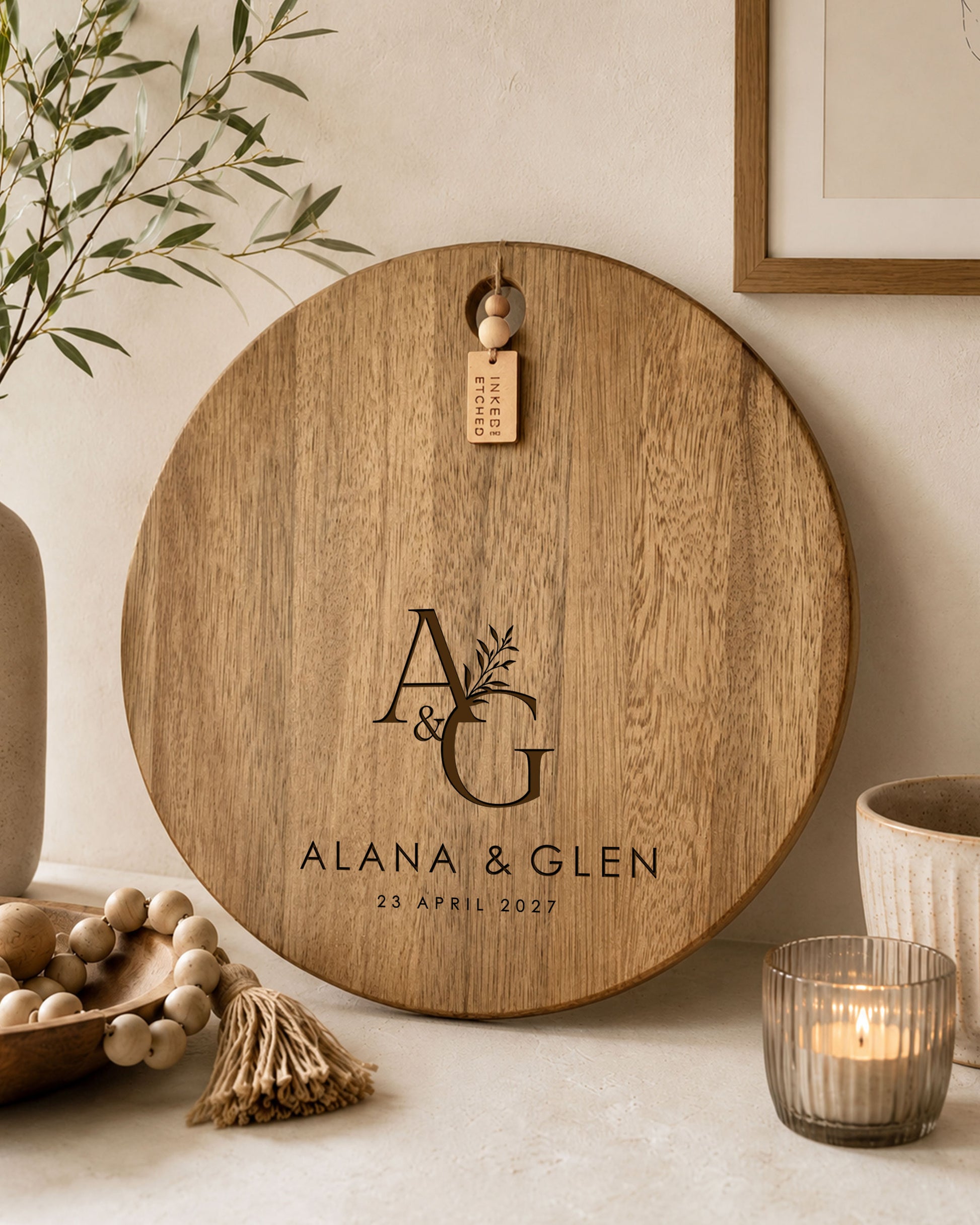Custom engraved wedding charcuterie board with initials, names and wedding date on natural acacia timber.