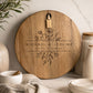 Custom engraved acacia wedding cheeseboard displayed in a modern kitchen with neutral styling.