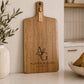 Handmade personalised engraved paddle serving board crafted from acacia timber for entertaining and gifting.