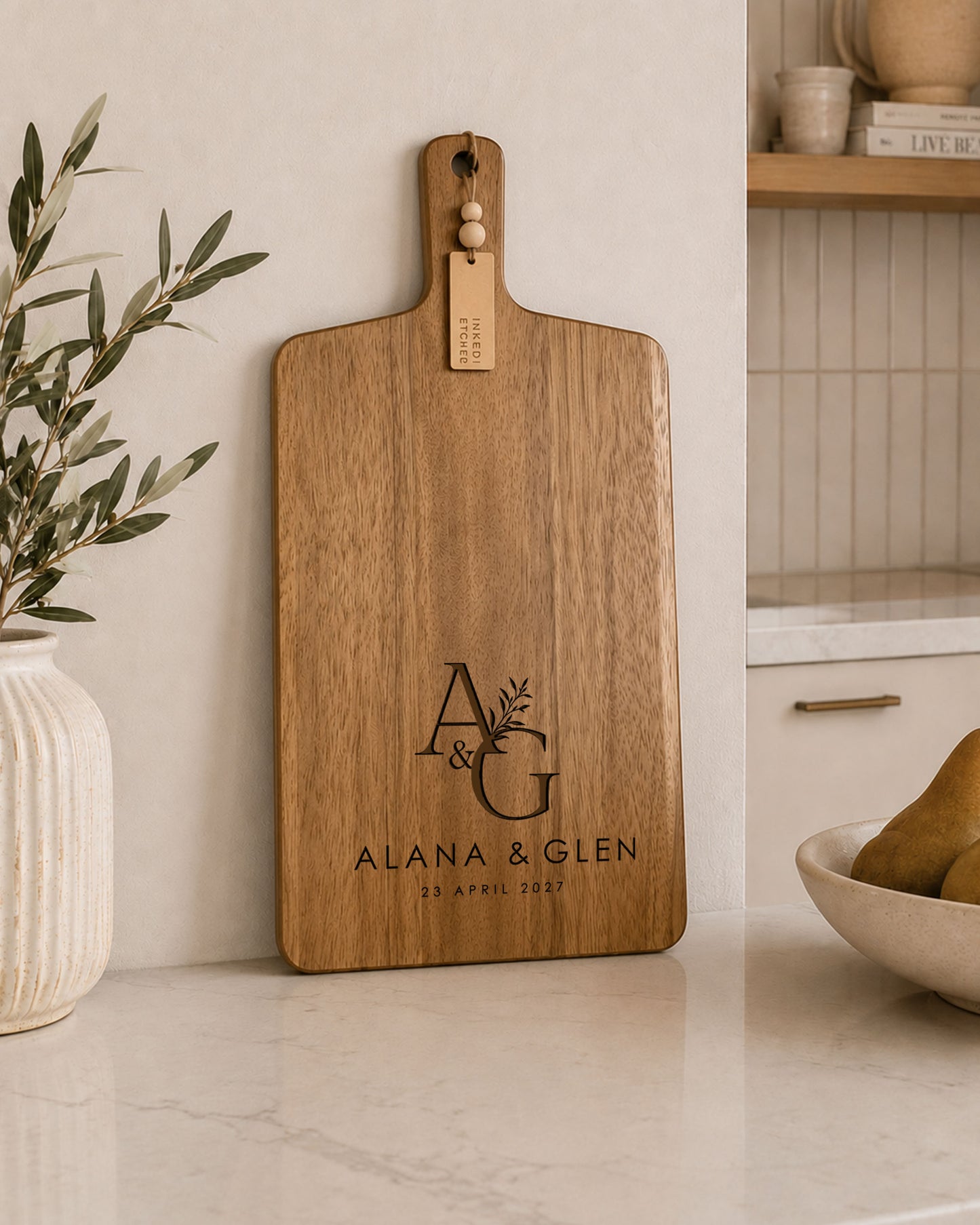 Handmade personalised engraved paddle serving board crafted from acacia timber for entertaining and gifting.