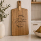 Custom charcuterie board engraved with a personalised family name, handcrafted from natural acacia timber for serving and entertaining.