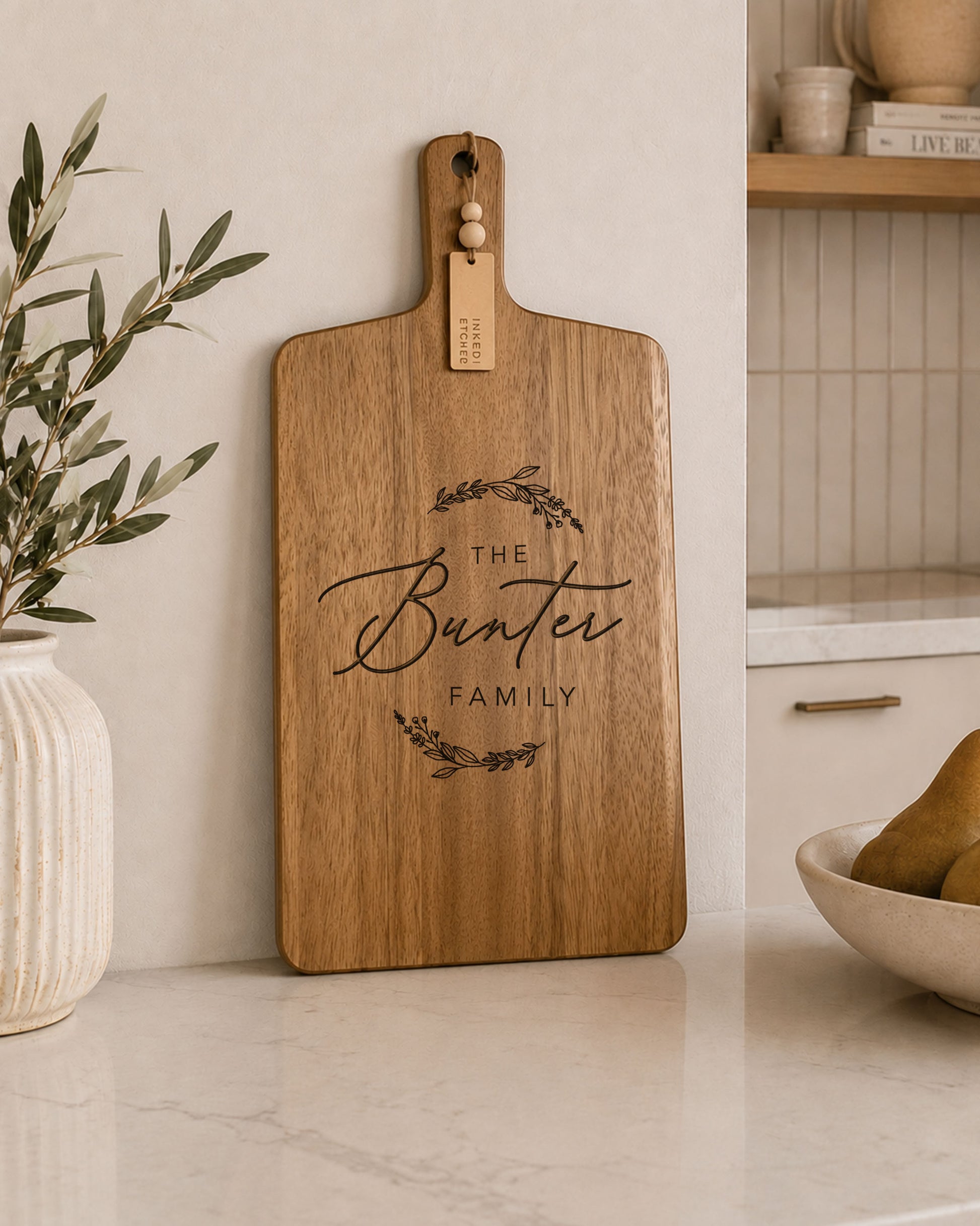 Custom charcuterie board engraved with a personalised family name, handcrafted from natural acacia timber for serving and entertaining.
