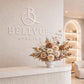 White 3D acrylic logo sign mounted on a modern business reception wall creating elegant custom wall branding.