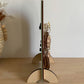 Side view showing the slim profile, hooks and timber feet of a wooden keyring display stand.